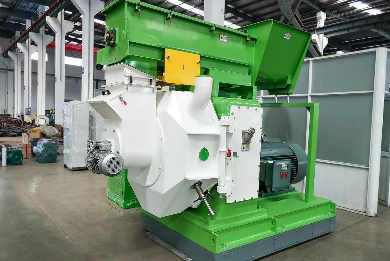 Ring die biomass pellet machine with open panel showing die and roller assembly